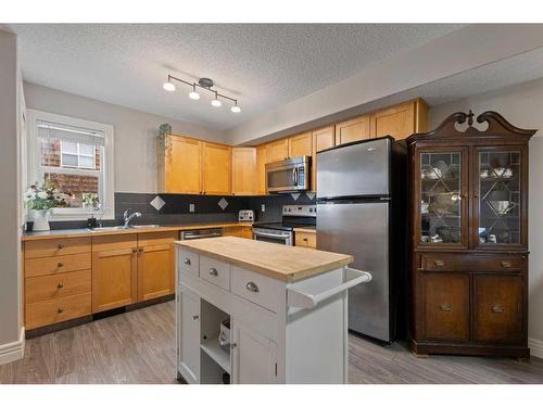 245 Bridlewood Lane Sw, Calgary, AB - Indoor Photo Showing Kitchen With Stainless Steel Kitchen With Double Sink