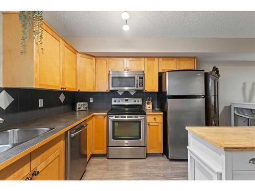 245 Bridlewood Lane Sw, Calgary, AB - Indoor Photo Showing Kitchen With Stainless Steel Kitchen