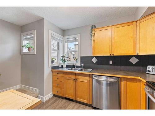 245 Bridlewood Lane Sw, Calgary, AB - Indoor Photo Showing Kitchen With Double Sink