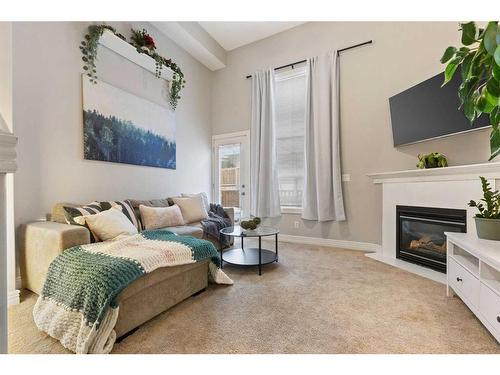 245 Bridlewood Lane Sw, Calgary, AB - Indoor Photo Showing Living Room With Fireplace