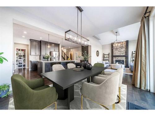 699 Cranston Avenue Se, Calgary, AB - Indoor Photo Showing Dining Room With Fireplace