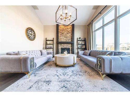 699 Cranston Avenue Se, Calgary, AB - Indoor Photo Showing Living Room With Fireplace