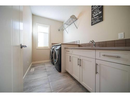 699 Cranston Avenue Se, Calgary, AB - Indoor Photo Showing Laundry Room