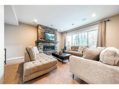 699 Cranston Avenue Se, Calgary, AB - Indoor Photo Showing Living Room With Fireplace