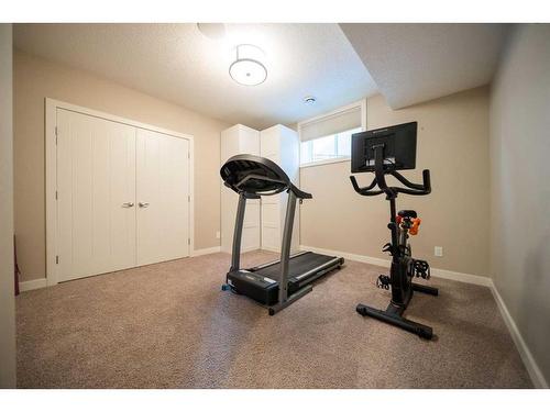 699 Cranston Avenue Se, Calgary, AB - Indoor Photo Showing Gym Room