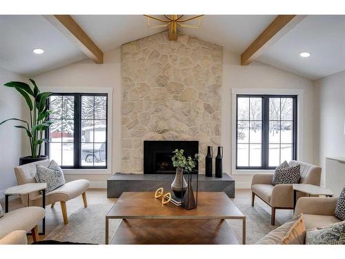 7028 Kennedy Drive Sw, Calgary, AB - Indoor Photo Showing Living Room With Fireplace