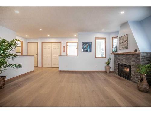 2 Cedarview Mews Sw, Calgary, AB - Indoor Photo Showing Living Room With Fireplace