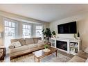 311 Mt Lorette Place Se, Calgary, AB  - Indoor Photo Showing Living Room With Fireplace 