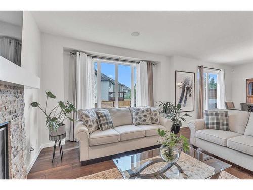 16 Masters Way Se, Calgary, AB - Indoor Photo Showing Living Room With Fireplace