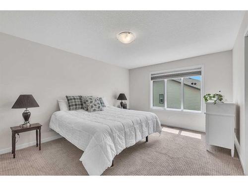 16 Masters Way Se, Calgary, AB - Indoor Photo Showing Bedroom