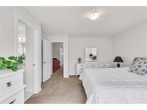 16 Masters Way Se, Calgary, AB - Indoor Photo Showing Bedroom