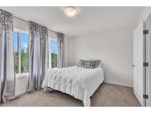 16 Masters Way Se, Calgary, AB - Indoor Photo Showing Bedroom