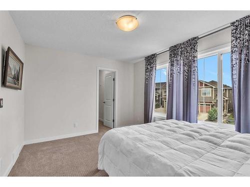 16 Masters Way Se, Calgary, AB - Indoor Photo Showing Bedroom