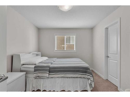 16 Masters Way Se, Calgary, AB - Indoor Photo Showing Bedroom