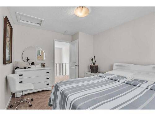 16 Masters Way Se, Calgary, AB - Indoor Photo Showing Bedroom