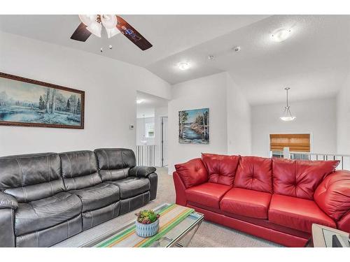 16 Masters Way Se, Calgary, AB - Indoor Photo Showing Living Room