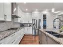 16 Masters Way Se, Calgary, AB  - Indoor Photo Showing Kitchen With Double Sink With Upgraded Kitchen 