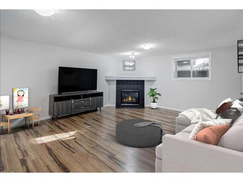 126 Auburn Bay Heights Se, Calgary, AB - Indoor Photo Showing Living Room With Fireplace