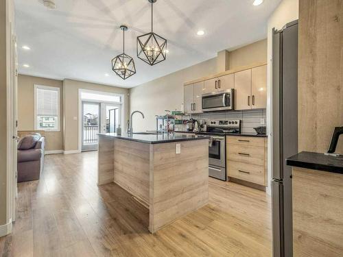 1-75 Aquitania Circle West, Lethbridge, AB - Indoor Photo Showing Kitchen With Stainless Steel Kitchen With Upgraded Kitchen