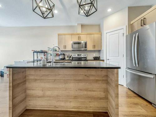 1-75 Aquitania Circle West, Lethbridge, AB - Indoor Photo Showing Kitchen With Stainless Steel Kitchen