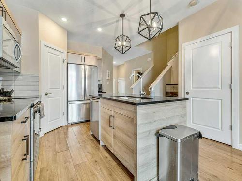 1-75 Aquitania Circle West, Lethbridge, AB - Indoor Photo Showing Kitchen With Stainless Steel Kitchen With Upgraded Kitchen