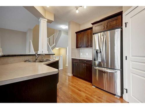 75 Cranleigh Heath Se, Calgary, AB - Indoor Photo Showing Kitchen With Stainless Steel Kitchen With Double Sink