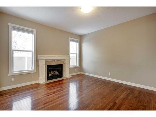 75 Cranleigh Heath Se, Calgary, AB - Indoor Photo Showing Living Room With Fireplace