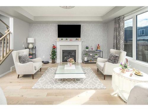 24 Carrington Rise Nw, Calgary, AB - Indoor Photo Showing Living Room With Fireplace