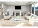 24 Carrington Rise Nw, Calgary, AB  - Indoor Photo Showing Living Room With Fireplace 