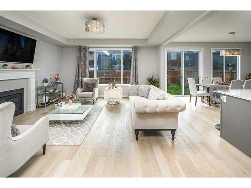 24 Carrington Rise Nw, Calgary, AB - Indoor Photo Showing Living Room With Fireplace