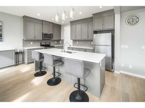 24 Carrington Rise Nw, Calgary, AB - Indoor Photo Showing Kitchen With Double Sink With Upgraded Kitchen