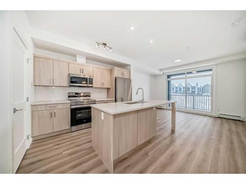 204-60 Sage Hill Walk Nw, Calgary, AB - Indoor Photo Showing Kitchen With Upgraded Kitchen