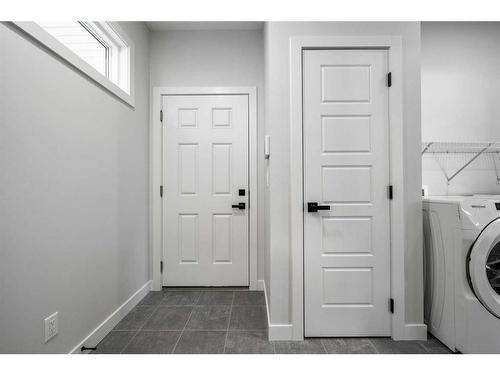 483 Rivercrest Road West, Cochrane, AB - Indoor Photo Showing Laundry Room