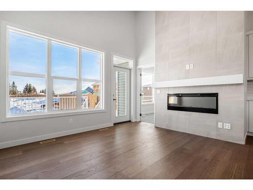 483 Rivercrest Road West, Cochrane, AB - Indoor Photo Showing Living Room With Fireplace