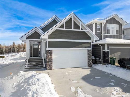 483 Rivercrest Road West, Cochrane, AB - Outdoor With Facade