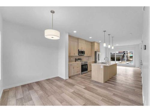 938 Cobblemore Common Sw, Airdrie, AB - Indoor Photo Showing Kitchen With Upgraded Kitchen