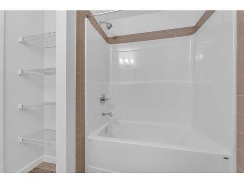 938 Cobblemore Common Sw, Airdrie, AB - Indoor Photo Showing Bathroom