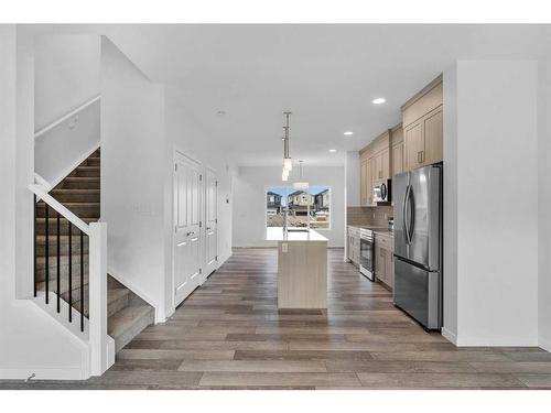 938 Cobblemore Common Sw, Airdrie, AB - Indoor Photo Showing Kitchen With Stainless Steel Kitchen