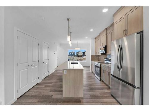 938 Cobblemore Common Sw, Airdrie, AB - Indoor Photo Showing Kitchen With Stainless Steel Kitchen