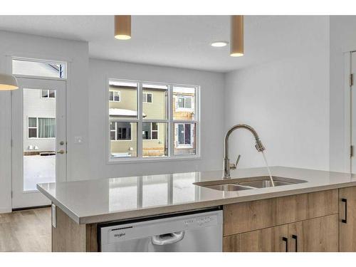 62 Sugarsnap Gardens Se, Calgary, AB - Indoor Photo Showing Kitchen With Double Sink