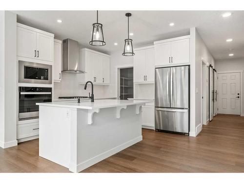 382 Rivercrest Road, Cochrane, AB - Indoor Photo Showing Kitchen With Upgraded Kitchen