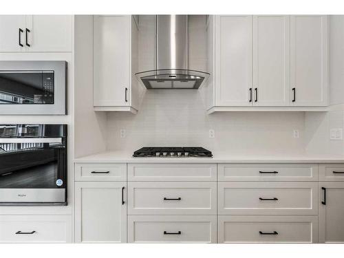 382 Rivercrest Road, Cochrane, AB - Indoor Photo Showing Kitchen With Fireplace With Upgraded Kitchen