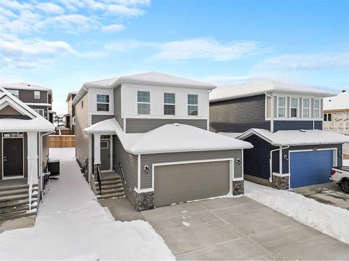 382 Rivercrest Road, Cochrane, AB - Outdoor With Facade