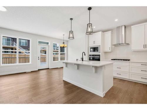 382 Rivercrest Road, Cochrane, AB - Indoor Photo Showing Kitchen With Fireplace With Upgraded Kitchen