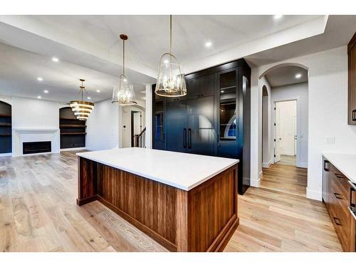 76 Aspen Ridge Square Sw, Calgary, AB - Indoor Photo Showing Kitchen With Fireplace With Upgraded Kitchen