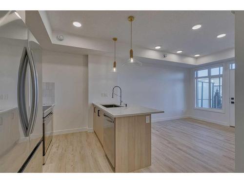 306-562 Seton Circle Se, Calgary, AB - Indoor Photo Showing Kitchen With Upgraded Kitchen