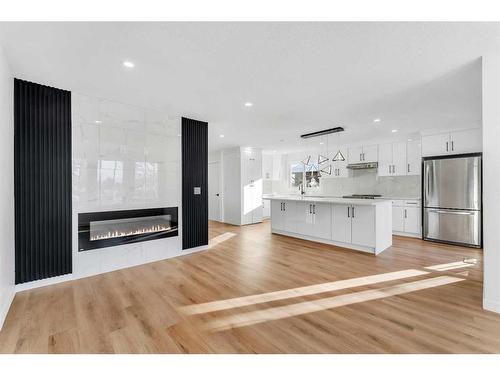 1190 Ranchlands Boulevard Nw, Calgary, AB - Indoor Photo Showing Kitchen With Fireplace With Upgraded Kitchen