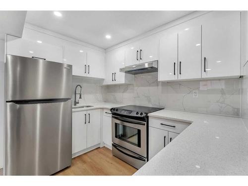 1190 Ranchlands Boulevard Nw, Calgary, AB - Indoor Photo Showing Kitchen With Upgraded Kitchen