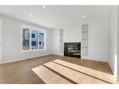 205 South Shore View, Chestermere, AB - Indoor Photo Showing Living Room With Fireplace