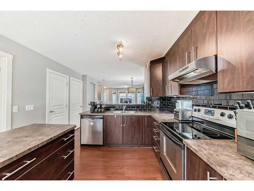 1809-2445 Kingsland Road Se, Airdrie, AB - Indoor Photo Showing Kitchen With Stainless Steel Kitchen